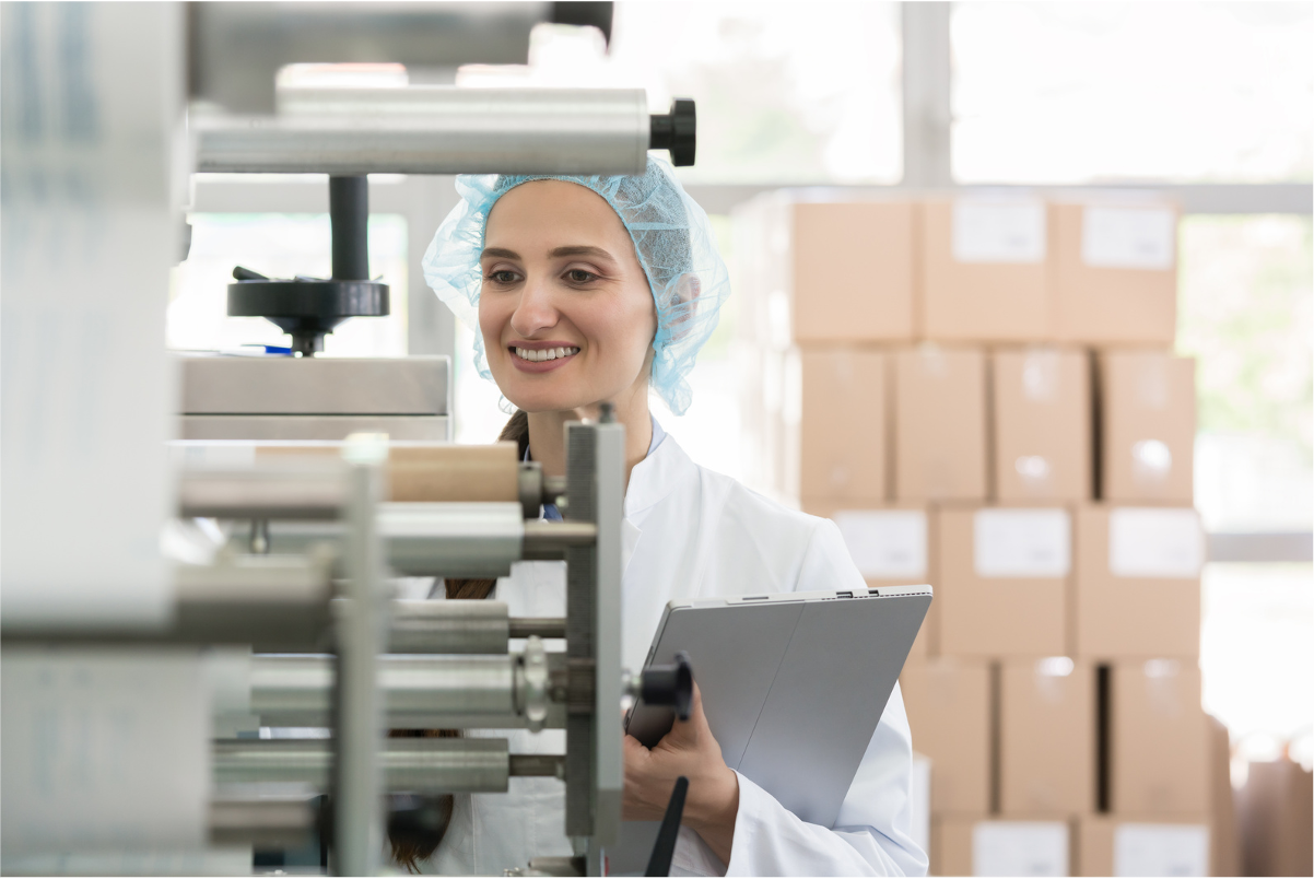 a PPE-clad woman doing quality check control